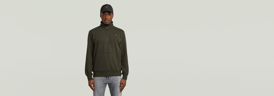 half zip sweater label badge