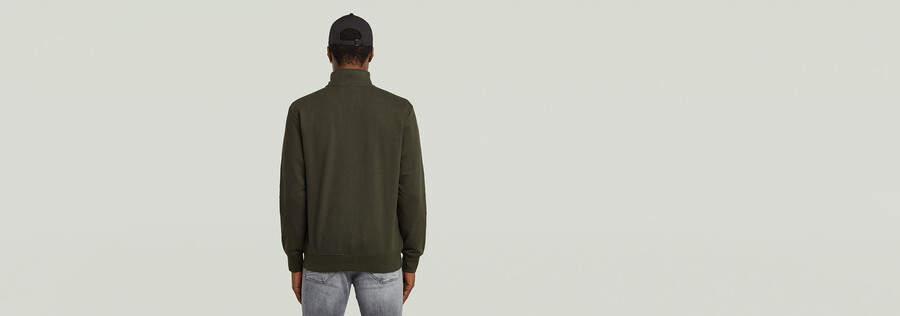 half zip sweater label badge
